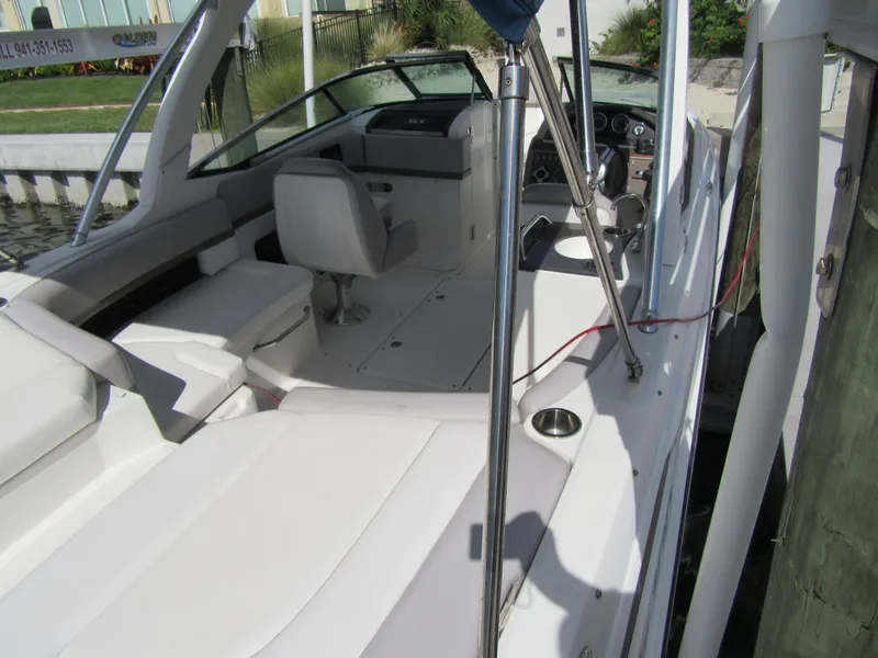 Slide: The Image of 2011 Sea Ray 250 SLX boat interior with seating and dashboard. - 39