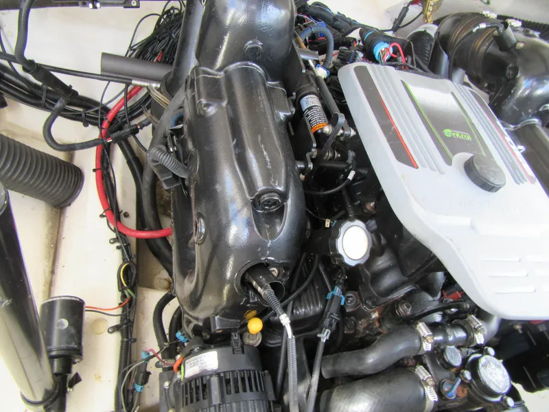 Slide: The Image of Engine compartment of a 2011 Sea Ray 250 SLX boat, showcasing detailed components. - 8