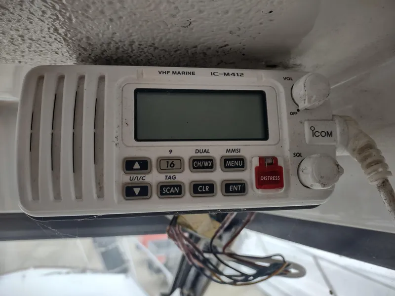 Slide: The Image of VHF marine radio IC-M412 on 1976 Trojan 260 Hardtop Express boat. - 14