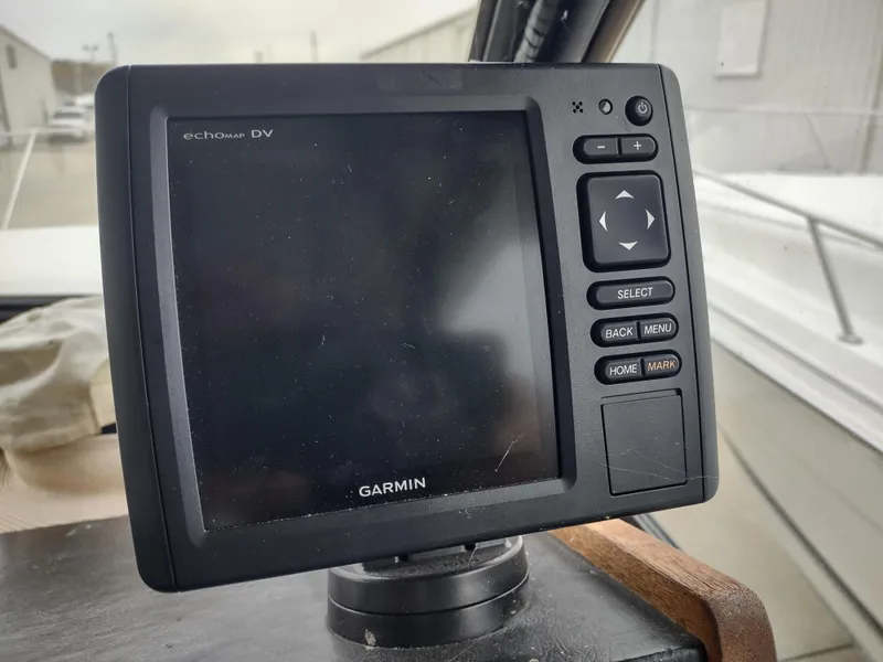 Slide: The Image of Garmin echomap DV on 1976 Trojan 260 Hardtop Express boat dashboard. - 15