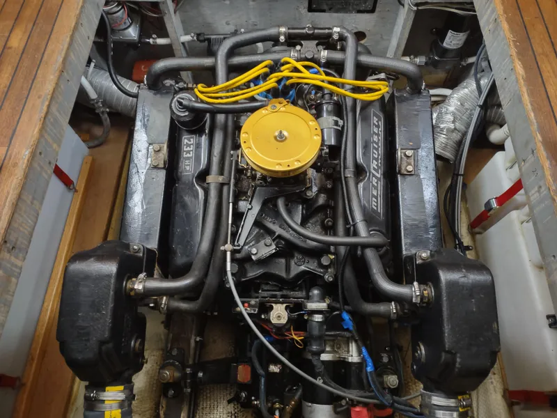 Slide: The Image of 1976 Trojan 260 Hardtop Express engine with yellow wires and black components. - 7