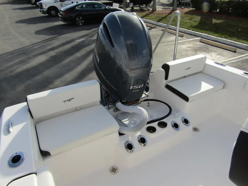 Slide: The Image of 2023 Tidewater 198 CC Adventure boat with 150 HP engine, rear seating, and rod holders. - 22
