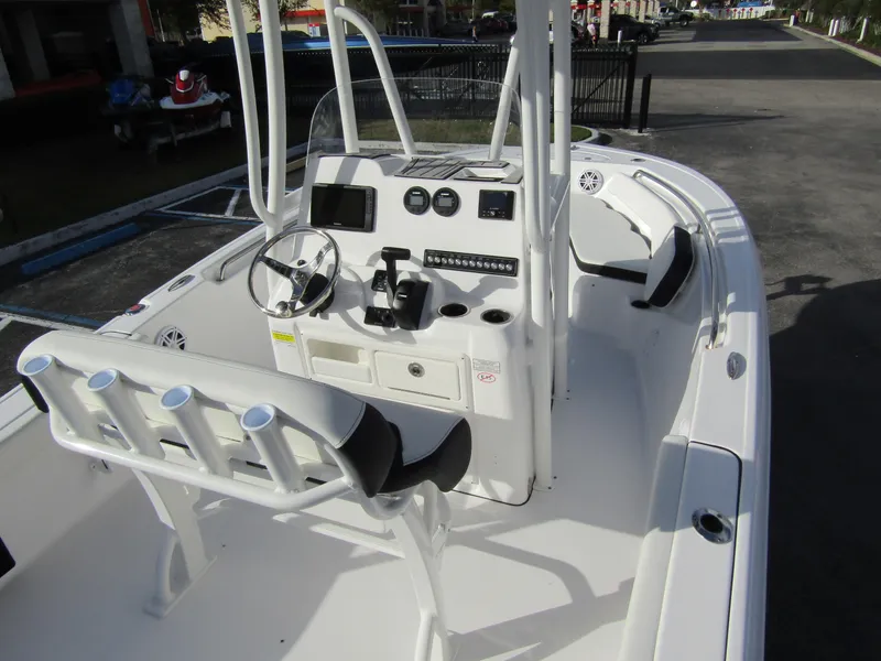Slide: The Image of 2023 Tidewater 198 CC Adventure boat interior with console and seating. - 25