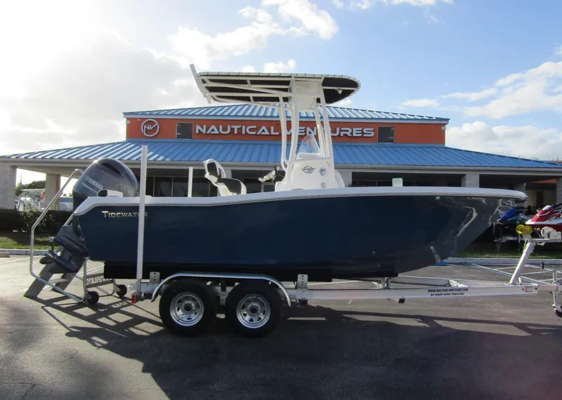 Slide: The Image of 2023 Tidewater 198 CC Adventure boat on trailer at Nautical Ventures dealership. - 4