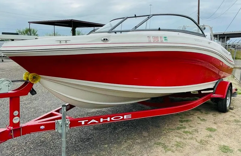Slide: The Image of 2016 Tahoe 500 TF red and white boat on trailer. - 2
