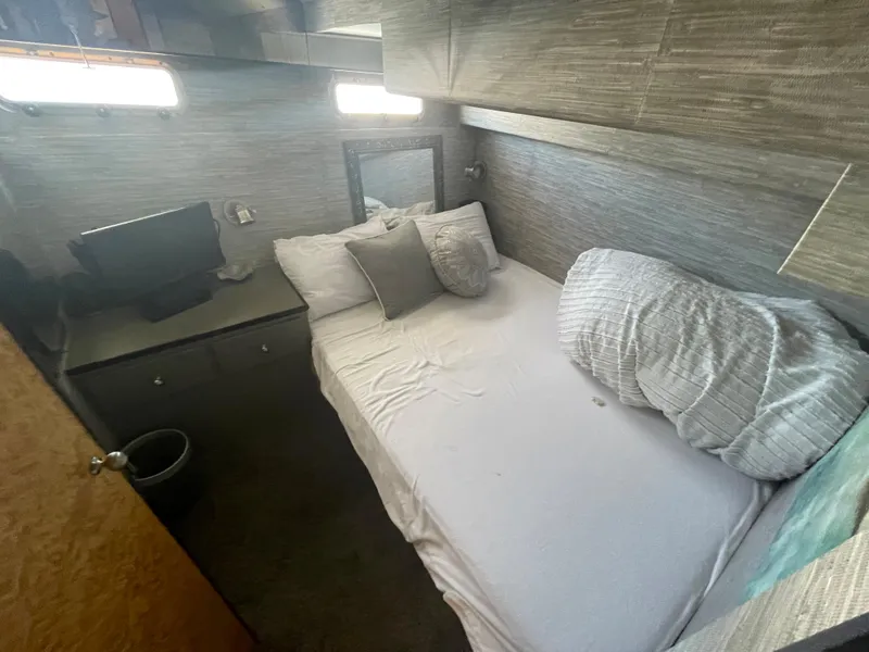 Slide: The Image of Cozy cabin interior of 1986 Sea Hawk Sedan with bed and small desk. - 20