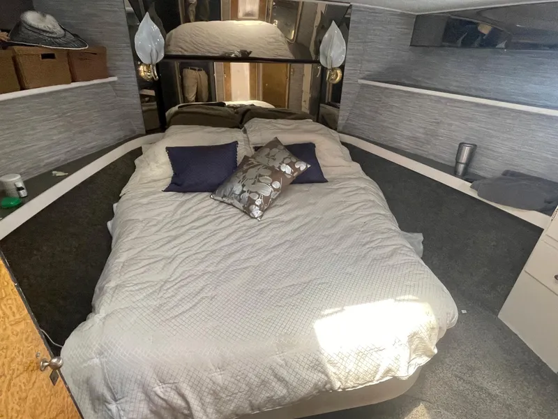 Slide: The Image of Cozy bedroom interior of 1986 Sea Hawk Sedan with bed, pillows, and modern decor. - 22