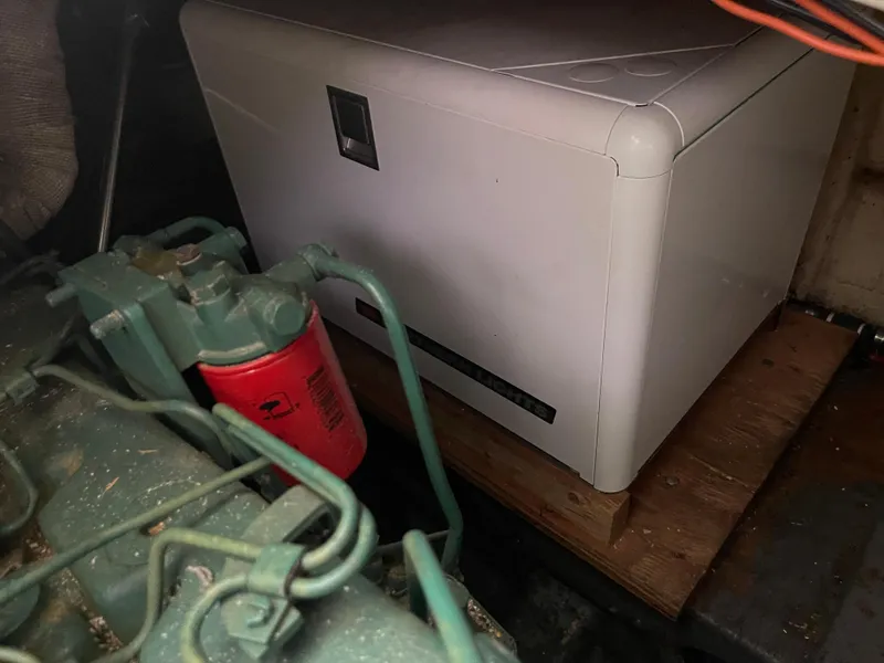 Slide: The Image of Engine compartment of a 1986 Sea Hawk Sedan with machinery and equipment. - 31