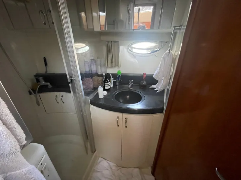 Slide: The Image of Compact bathroom in 1986 Sea Hawk Sedan with sink, mirror, and shower. - 39