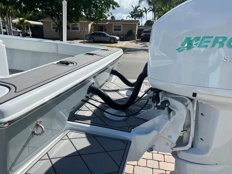 Slide: The Image of 1987 Intrepid 300 Center Console boat with Mercury outboard engine. - 10