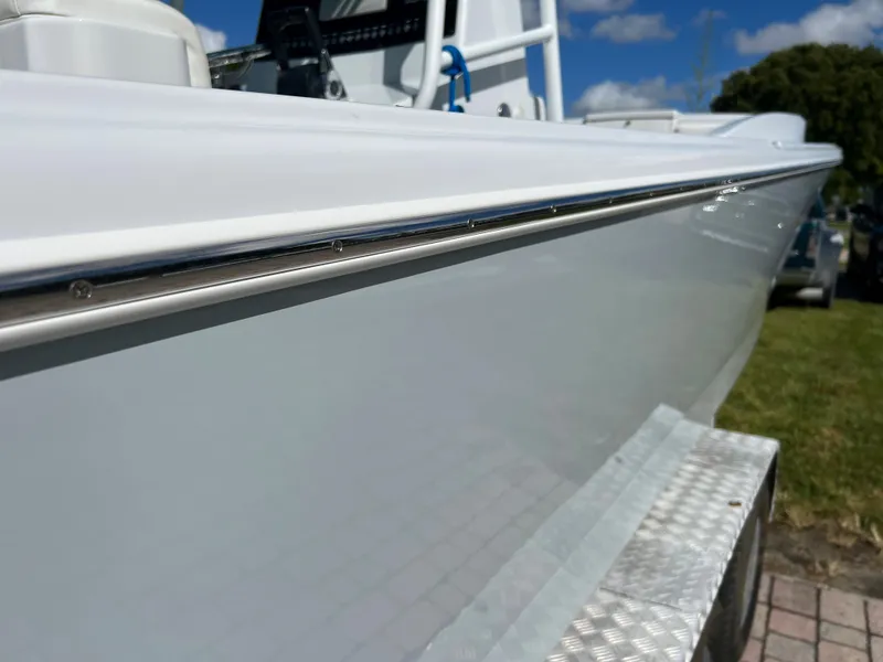 Slide: The Image of 1987 Intrepid 300 Center Console boat side view on trailer. - 13