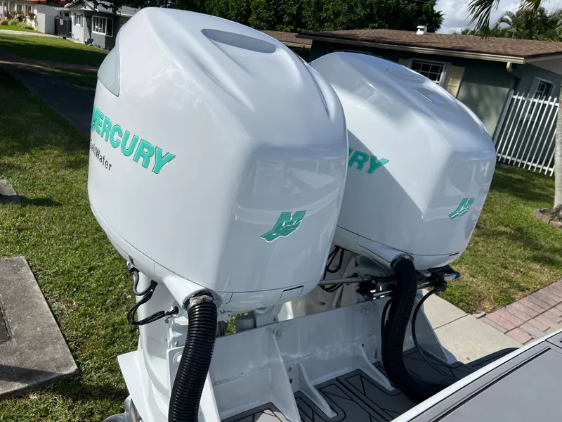 Slide: The Image of Twin Mercury outboard engines on a 1987 Intrepid 300 Center Console boat. - 24