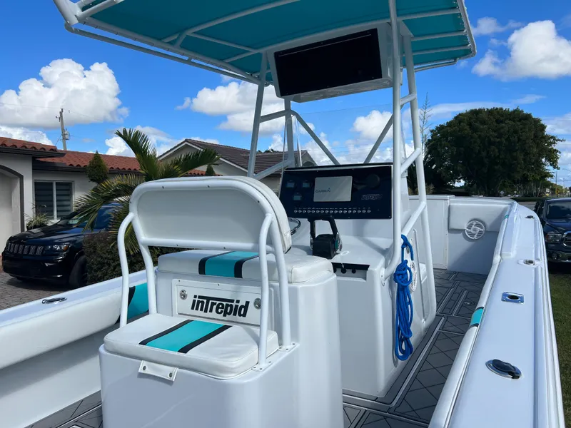 Slide: The Image of 1987 Intrepid 300 Center Console boat with modern helm and seating. - 25