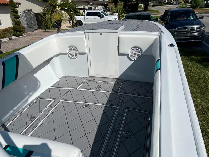 Slide: The Image of 1987 Intrepid 300 Center Console boat with spacious deck and modern flooring. - 29