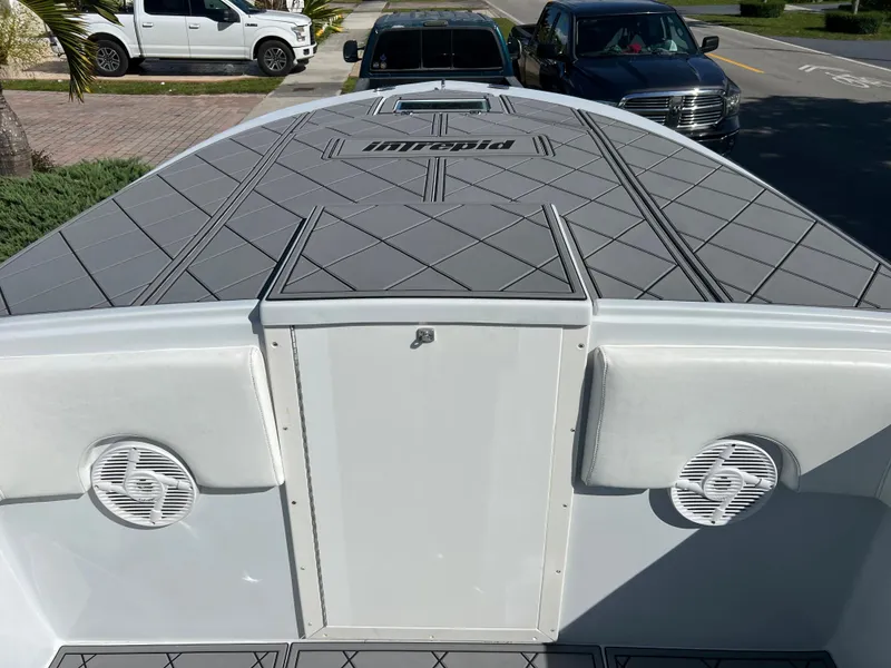 Slide: The Image of 1987 Intrepid 300 Center Console boat with modern deck and speakers. - 30