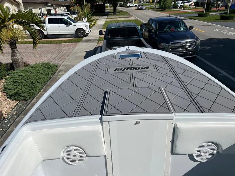 Slide: The Image of 1987 Intrepid 300 Center Console boat parked on a residential street. - 31