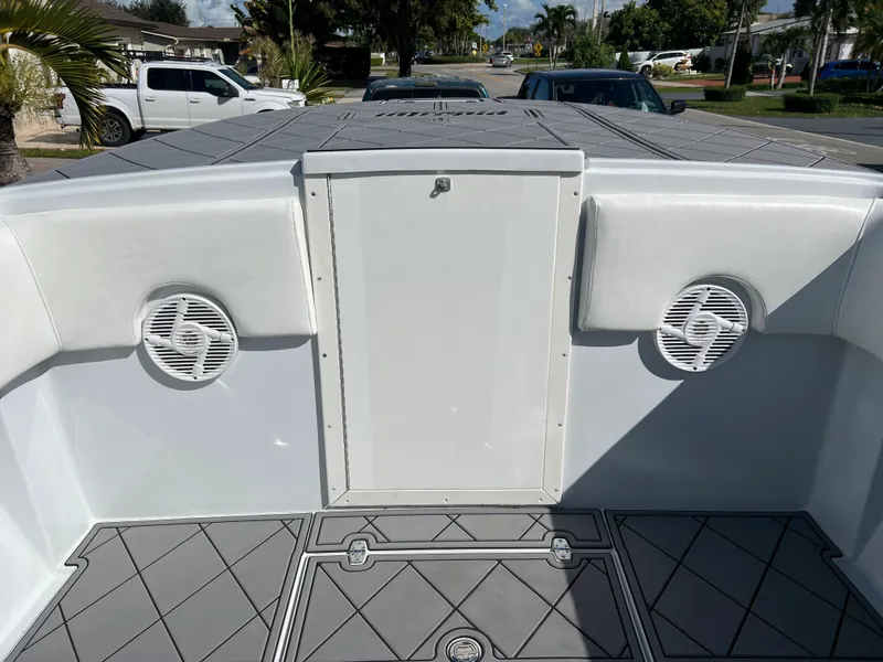 Slide: The Image of 1987 Intrepid 300 Center Console boat interior with speakers and storage compartment. - 32