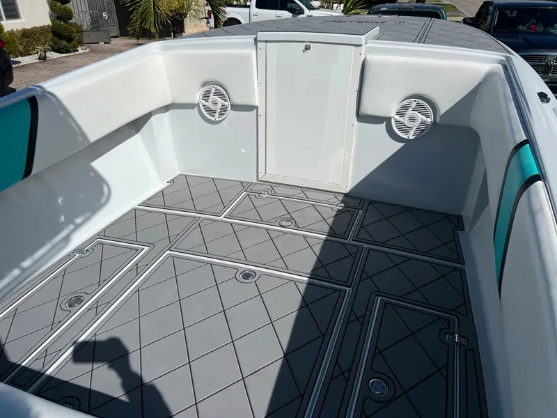 Slide: The Image of 1987 Intrepid 300 Center Console boat interior with gray diamond-patterned flooring. - 33