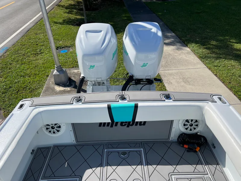 Slide: The Image of 1987 Intrepid 300 Center Console boat with twin outboard engines. - 37