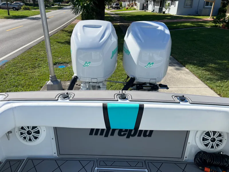 Slide: The Image of 1987 Intrepid 300 Center Console with dual outboard engines. - 38