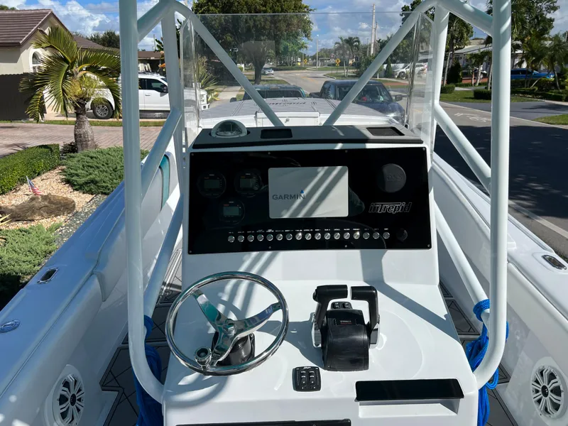 Slide: The Image of 1987 Intrepid 300 Center Console boat dashboard with Garmin navigation system. - 40