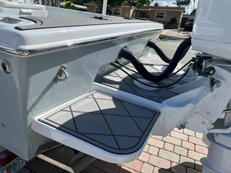 Slide: The Image of 1987 Intrepid 300 Center Console boat stern with outboard motor and swim platform. - 7