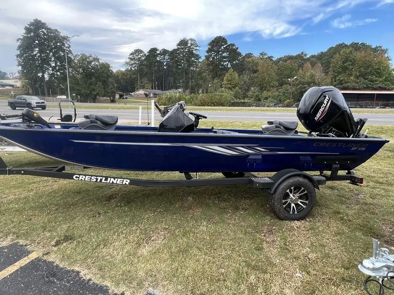 The Image of 2023 Crestliner XF 179 boat on a trailer, parked on grass. - 0