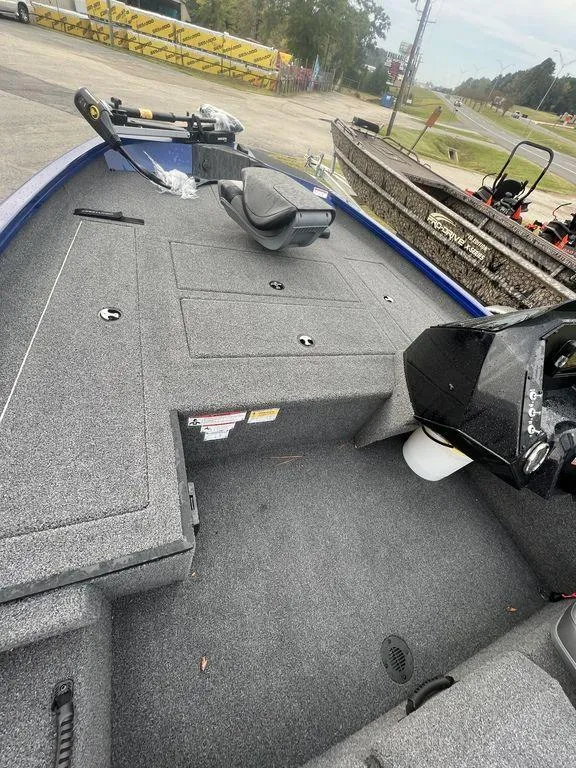 Slide: The Image of 2023 Crestliner XF 179 fishing boat with spacious deck and modern controls. - 1