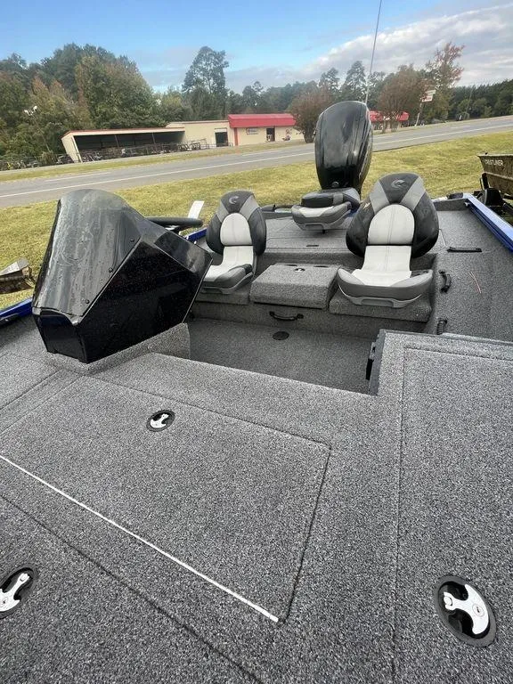 Slide: The Image of 2023 Crestliner XF 179 fishing boat with dual seats and storage compartments. - 3