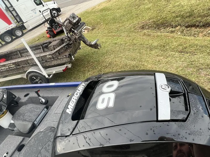 Slide: The Image of 2023 Crestliner XF 179 boat with Mercury 90 engine on grassy area. - 6