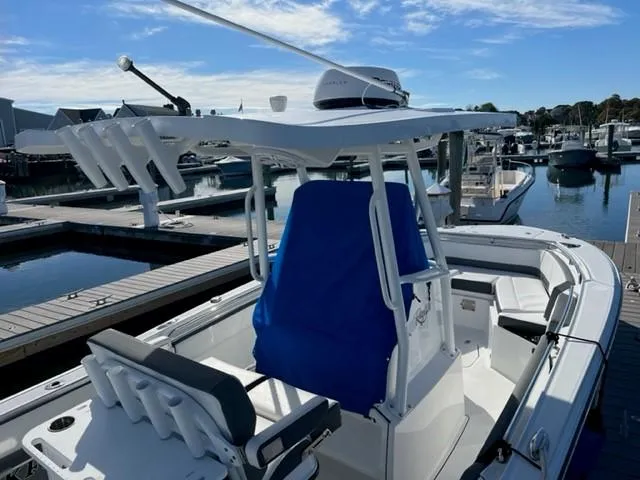 Slide: The Image of 2019 Blackfin 242 CC center console boat docked at a marina. - 4