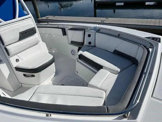 Slide: The Image of 2019 Blackfin 242 CC boat interior with white and gray seating. - 7