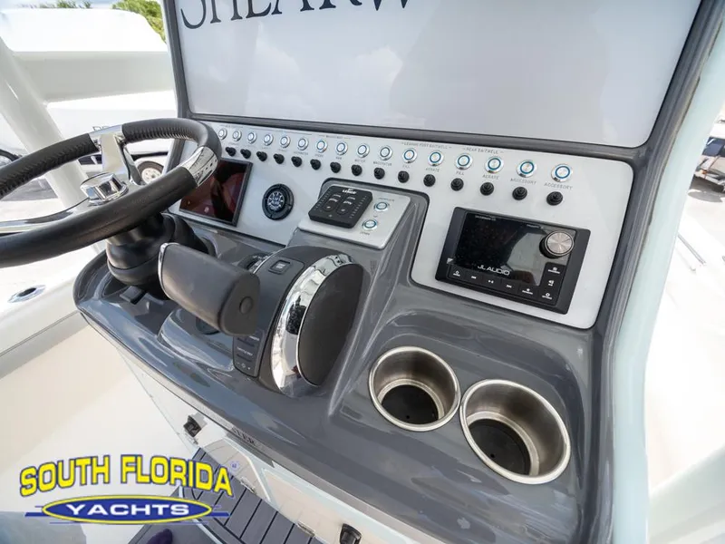 Slide: The Image of 2023 ShearWater 260 Carolina boat console with steering wheel and controls, South Florida Yachts. - 28
