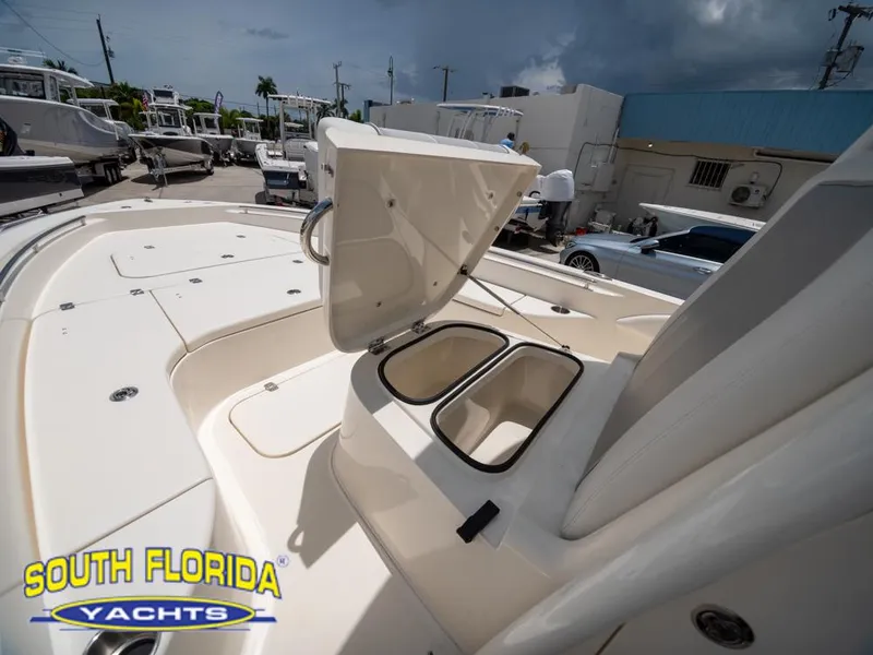 Slide: The Image of 2023 ShearWater 260 Carolina boat deck with open storage compartments at South Florida Yachts. - 31