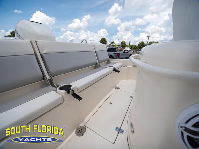 Slide: The Image of 2023 ShearWater 260 Carolina boat interior with seating, South Florida Yachts logo. - 9