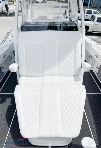 Slide: The Image of 2023 Fountain 34 TE boat with white diamond-stitched seating. - 12