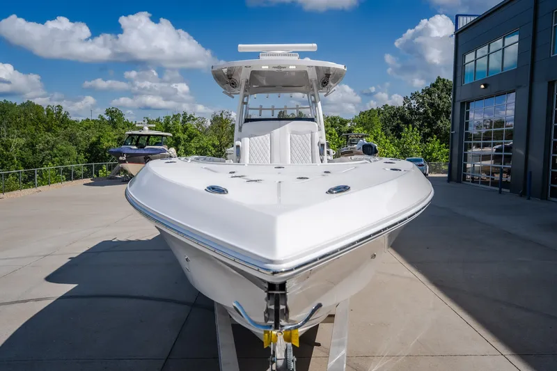 Slide: The Image of 2023 Fountain 34 Tournament Edition boat displayed outdoors on a sunny day. - 31