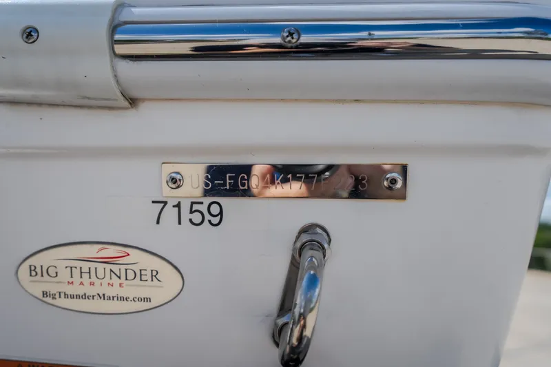 Slide: The Image of 2023 Fountain 34 Tournament Edition boat with Big Thunder Marine branding. - 23