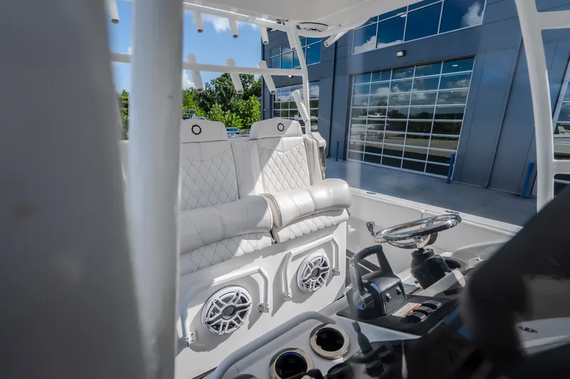 Slide: The Image of Interior of 2023 Fountain 34 Tournament Edition boat with luxurious seating and modern controls. - 58