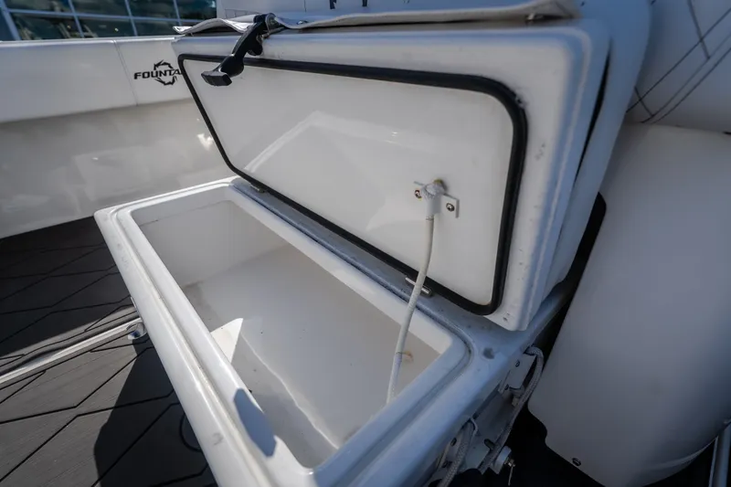 Slide: The Image of Open storage compartment on 2023 Fountain 34 Tournament Edition boat. - 90