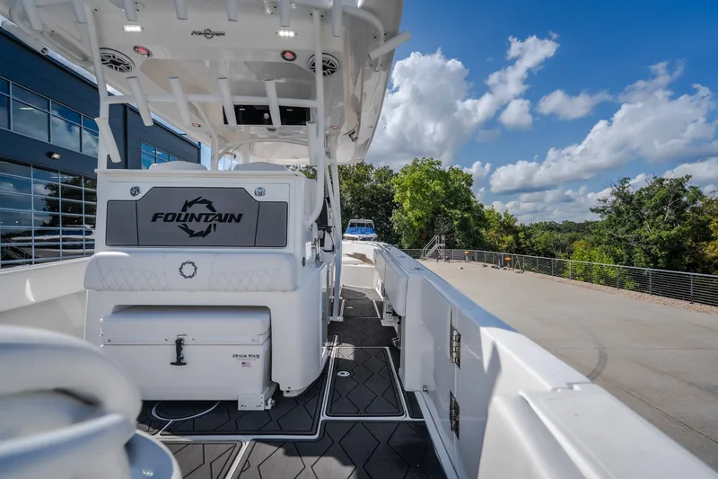 Slide: The Image of 2023 Fountain 34 Tournament Edition boat docked, showcasing sleek design and modern features. - 39