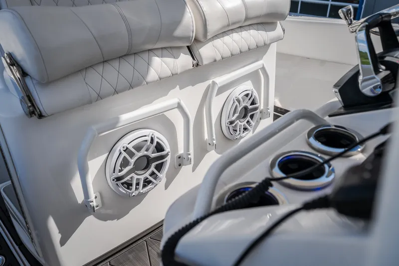 Slide: The Image of 2023 Fountain 34 Tournament Edition boat interior with speakers and cup holders. - 59