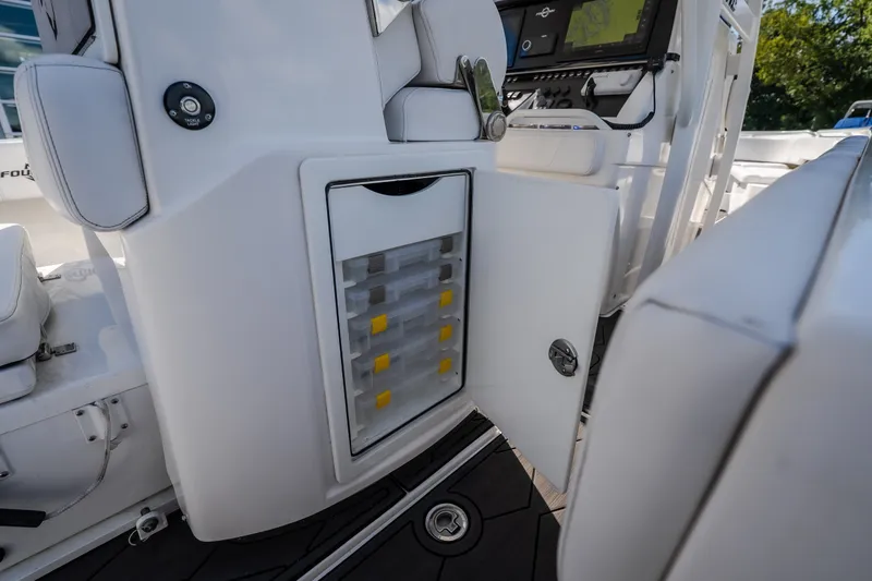 Slide: The Image of 2023 Fountain 34 Tournament Edition boat interior with storage compartment open. - 43