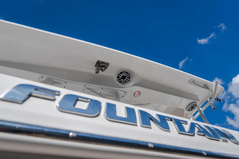 Slide: The Image of 2023 Fountain 34 Tournament Edition boat against a clear blue sky. - 79