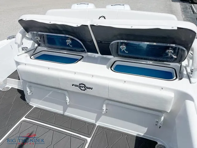 Slide: The Image of 2023 Fountain 34 TE boat with open storage compartments and seating. - 5