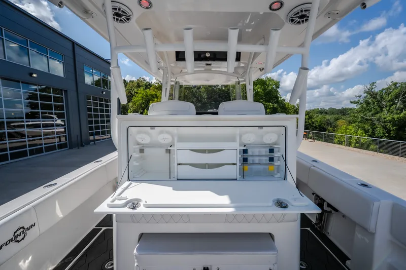 Slide: The Image of 2023 Fountain 34 Tournament Edition boat with fishing station and storage compartments. - 42