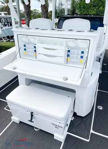 Slide: The Image of 2023 Fountain 34 TE boat interior with seating and storage compartments. - 8