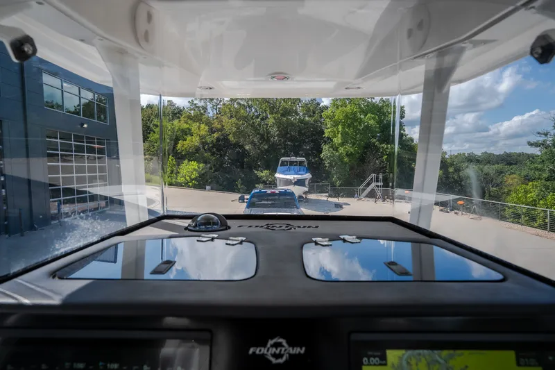 Slide: The Image of Interior view of 2023 Fountain 34 Tournament Edition boat, showcasing dashboard and windshield. - 55