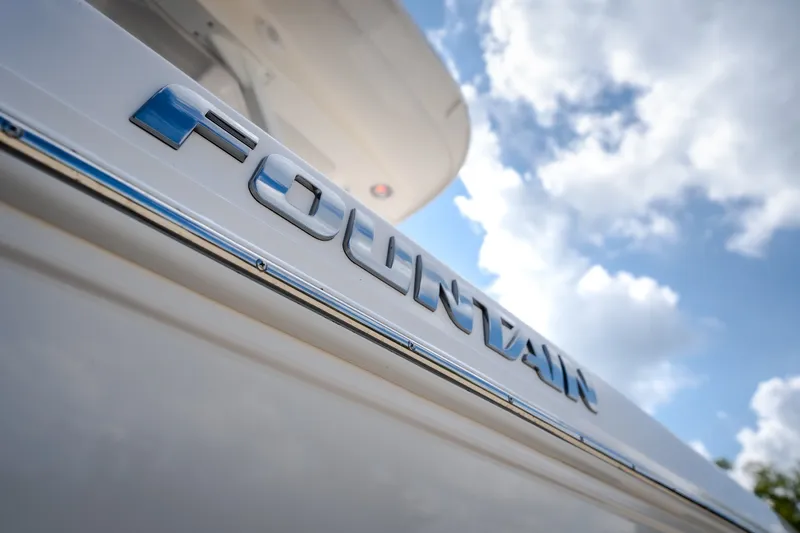 Slide: The Image of 2023 Fountain 34 Tournament Edition boat with logo against a cloudy sky. - 33