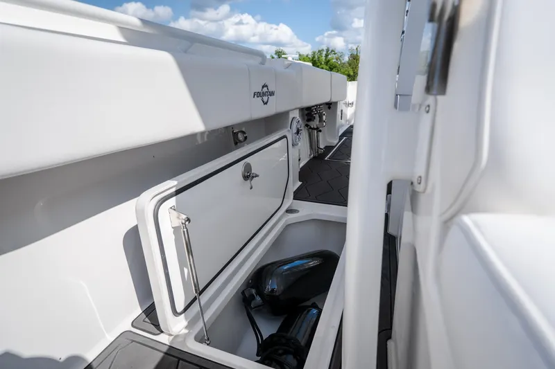 Slide: The Image of 2023 Fountain 34 Tournament Edition boat storage compartment with open hatch. - 76